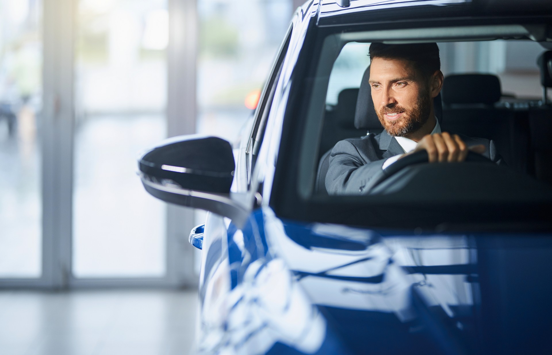 Man testing car at car dealership